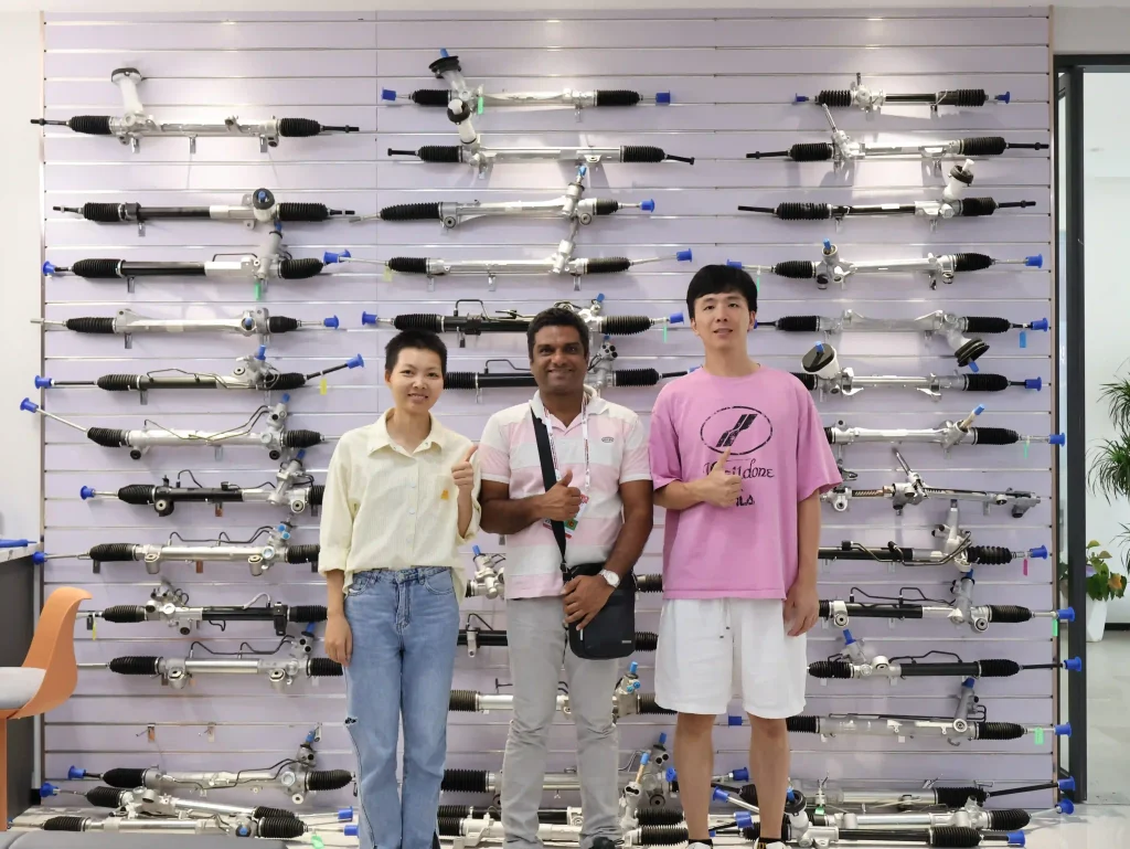 JCMSTECH team with auto parts customer during steering rack cooperation