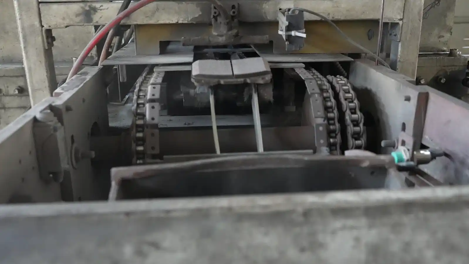 Brake pad grinding chamfering and slotting process